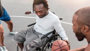 Man in wheelchair with basketball